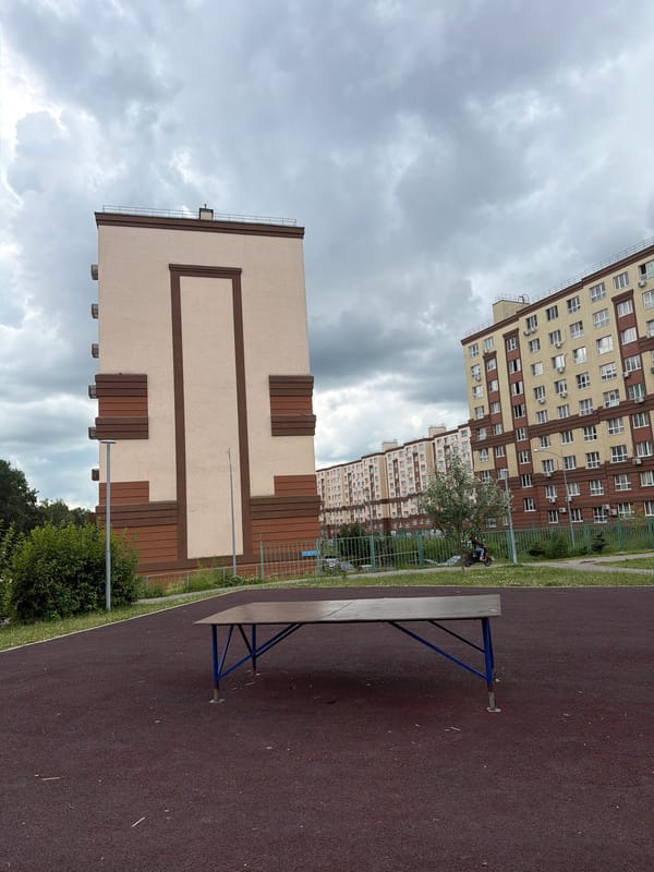 Afternoon in a Lopatino residential courtyard, June 2026