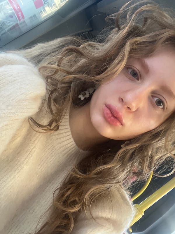 Woman takes early morning selfie on Vienna public transport