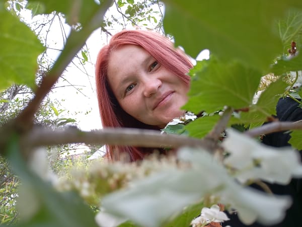 Woman documents dawn garden scenes in rural Russian town