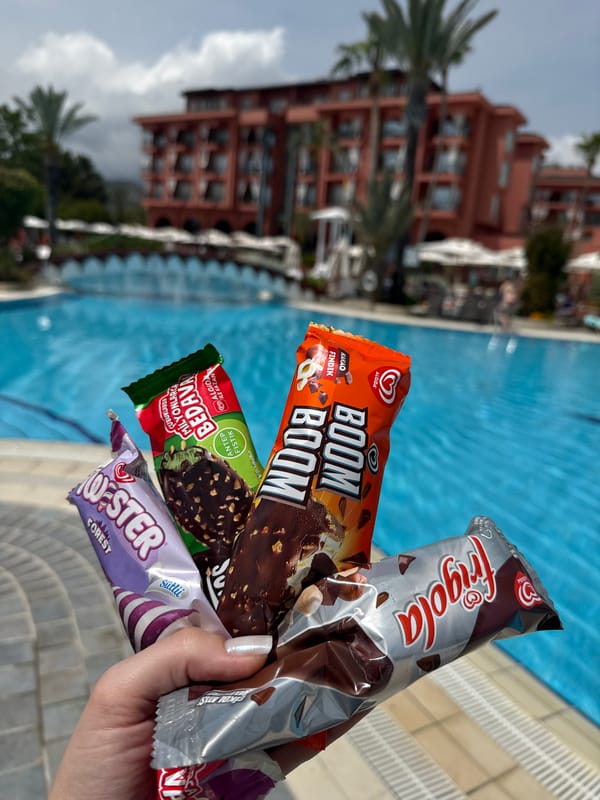 Resort guests enjoy ice cream treats by pool in Kemer