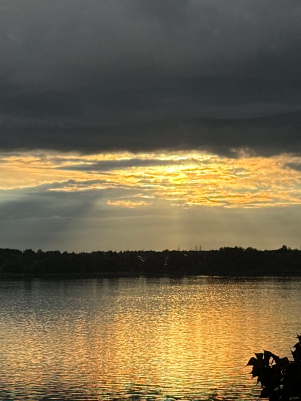 Dramatic sunrise/sunset captured over water near Noviy, Russia