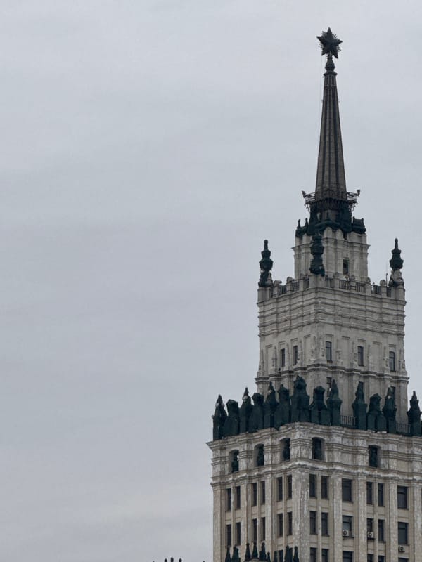 Moscow Stalinist skyscraper with Soviet star photographed under grey sky