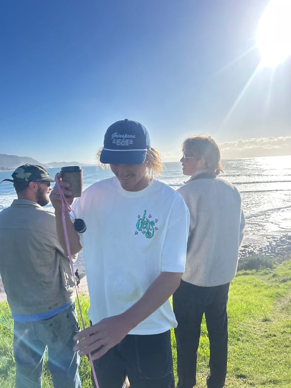 Evening beach gathering and surfing session at Bulli, Australia
