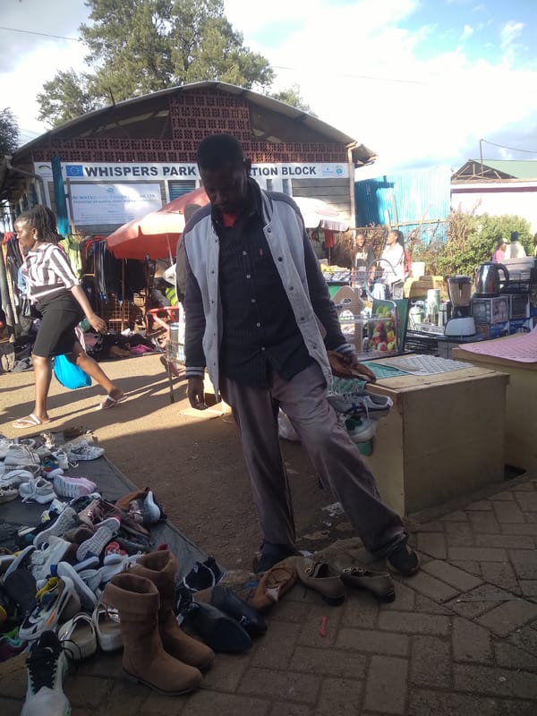 Street vendors operate outdoor market in Nyeri, Kenya