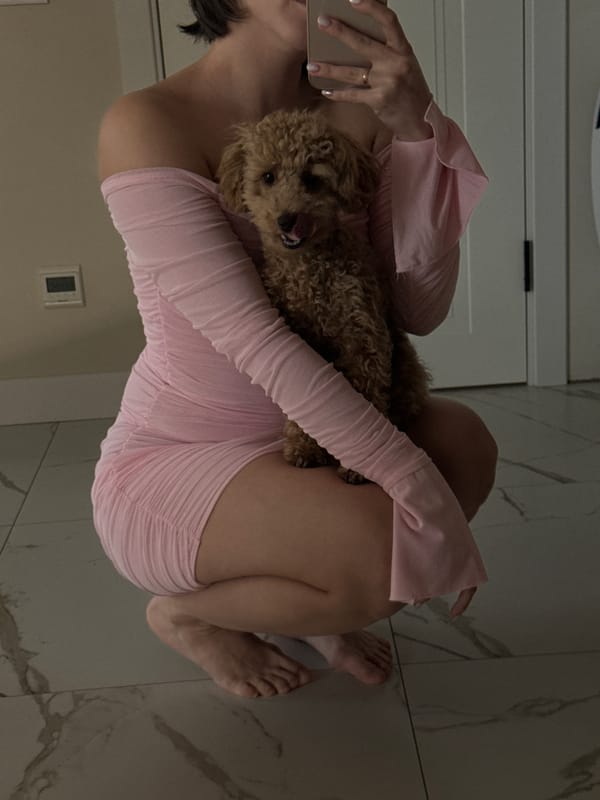Person takes mirror selfies with dog in Pervomaysky