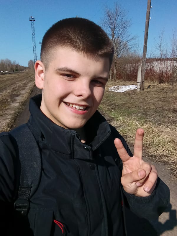 Young man takes selfies at railway yard in Andreyevo
