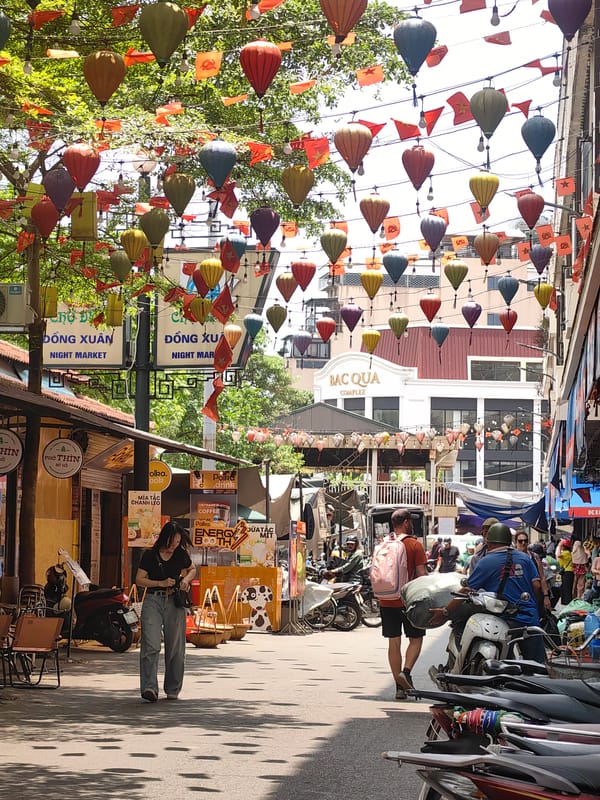 Early morning street activity documented near Hanoi's Đồng Xuân Market