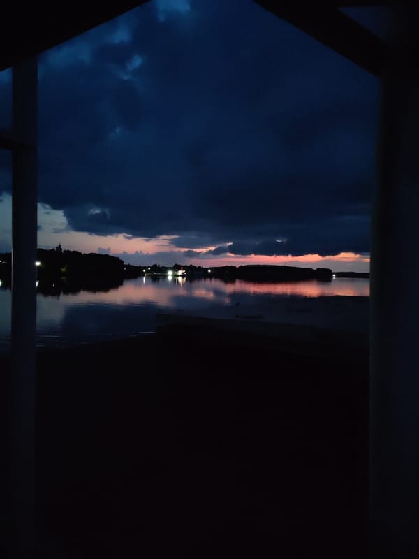 Twilight storm clouds gathering over a Russian lake or river