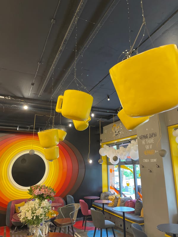 Visitor enjoys space-themed cafe atmosphere in Krasnoyarsk
