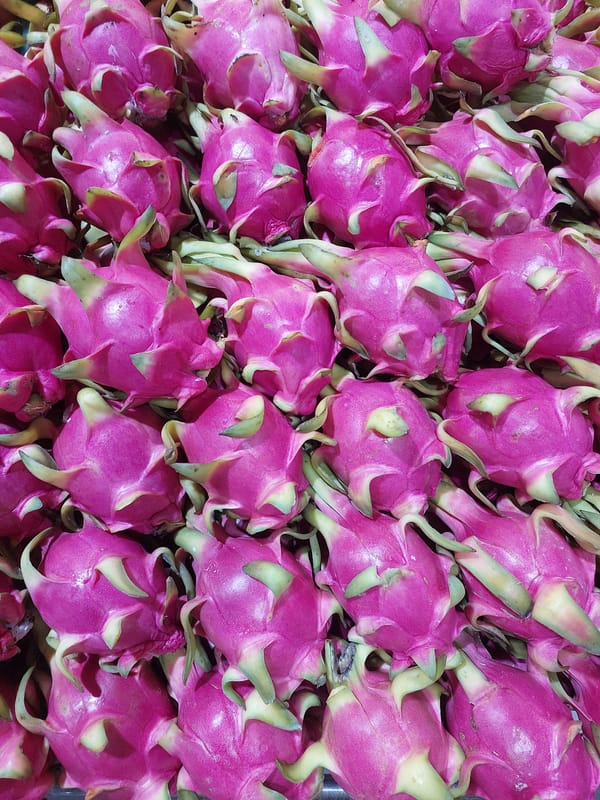 Fresh produce and packaged goods at a Baan Bo Phut market