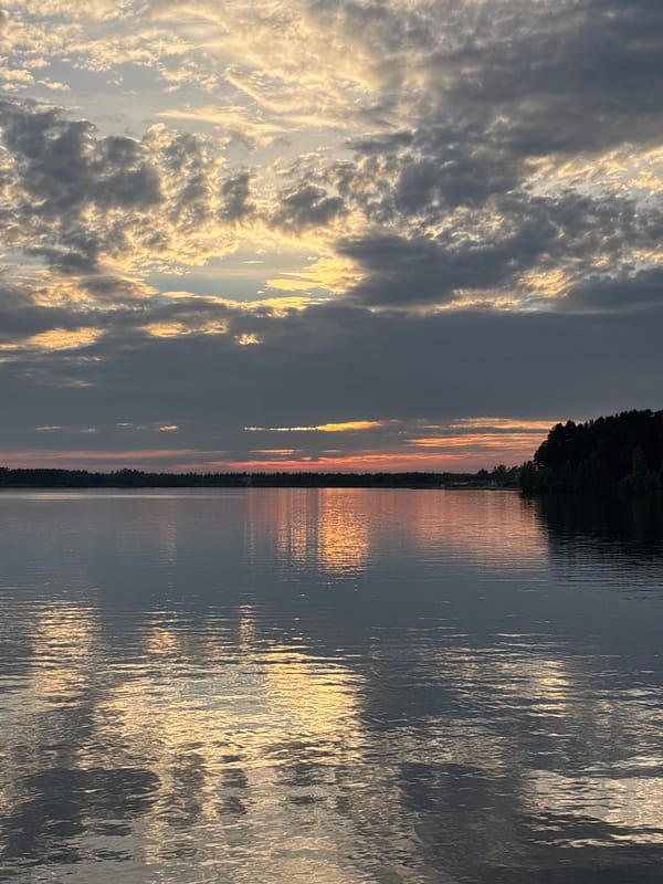 Sunset reflections on still water outside Zheleznogorsk