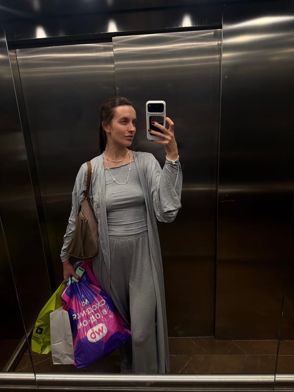 Woman takes elevator selfie while shopping in Moscow