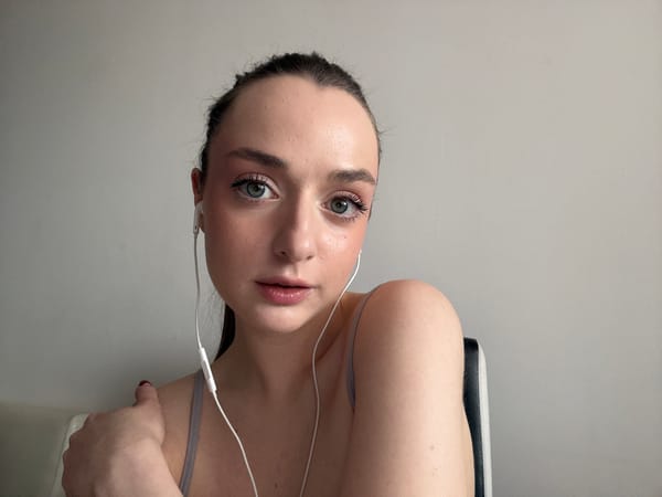 Woman with white object photographed indoors in Kragujevac