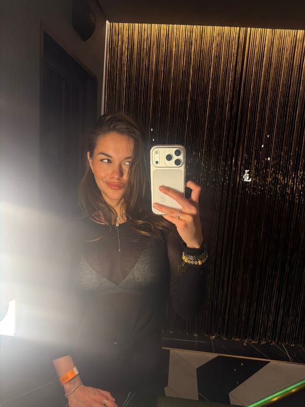 Woman takes selfie in interior space in Krasnoyarsk