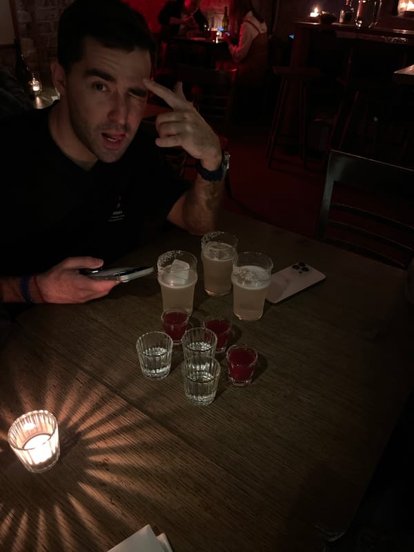 Man gestures at phone in Moscow bar