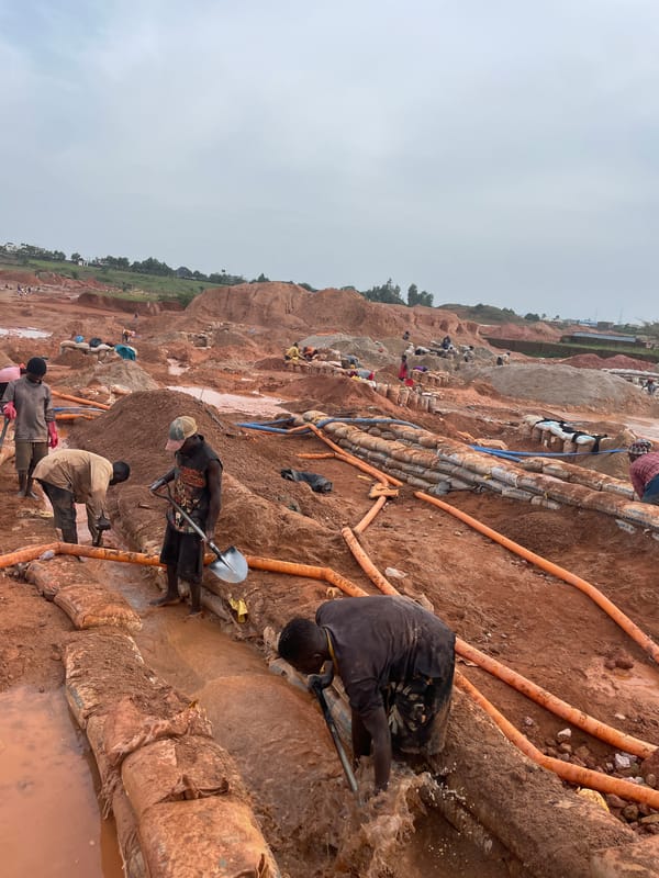 Hands-on excavation work at a muddy Rayfield, Nigeria dig site