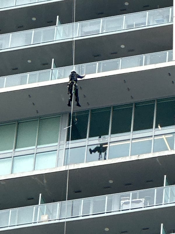 Urban scenes and cable-suspended figure documented in Coquitlam