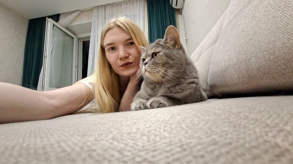 Woman documents indoor moments with cat in Chaikovsky, Russia
