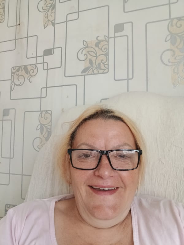 Woman takes selfies on white cushion in Красный Маяк