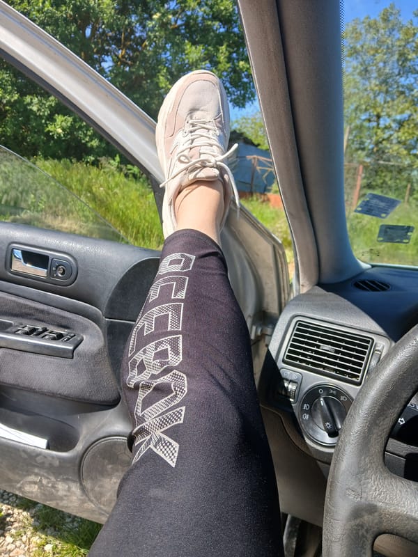 Driver rests with foot on car door in Sokolovo