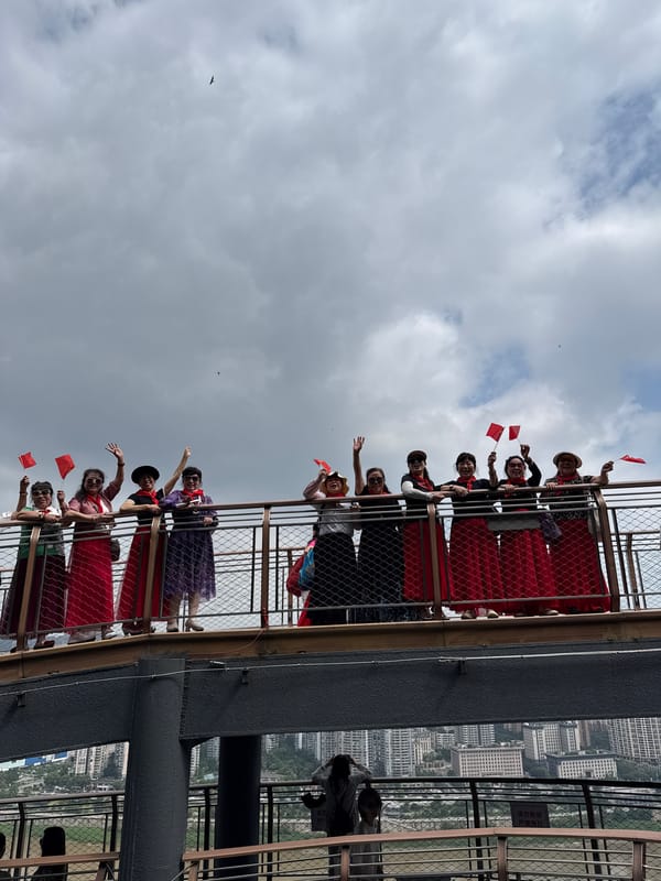 Women with flags gather on observation deck in Yuzhong