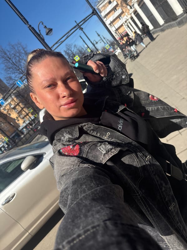 Woman takes selfie making peace sign in Perm