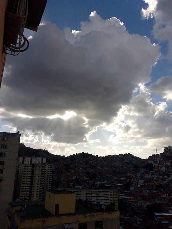 Dramatic sunset clouds captured over Caracas urban landscape