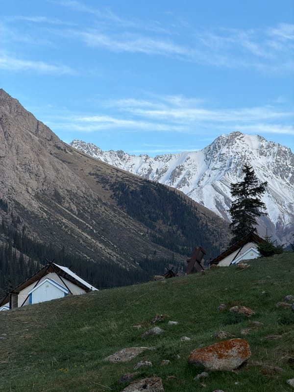 Traditional Kyrgyz mountain landscape with yurt documented by witness