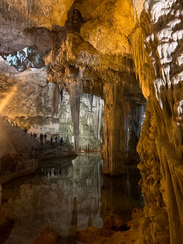 Tourists explore Neptune's Grotto cave system near Alghero, Italy