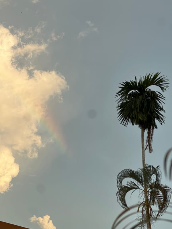 Golden clouds and partial rainbow observed in Si Sunthon