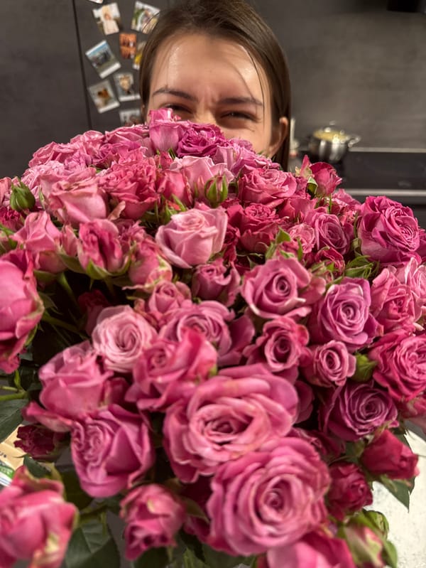 Valentine's Day celebration with roses and Corgi documented in Krasnoyarsk