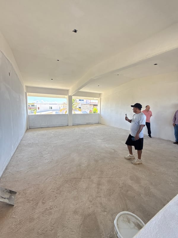 Construction workers renovate multi-story building in Acapulco