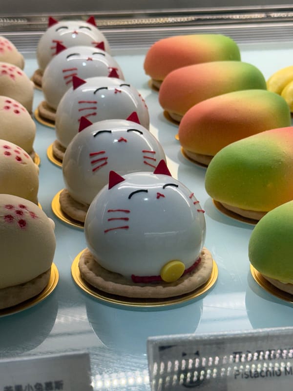 London bakery display case showcases arranged pastries Friday evening