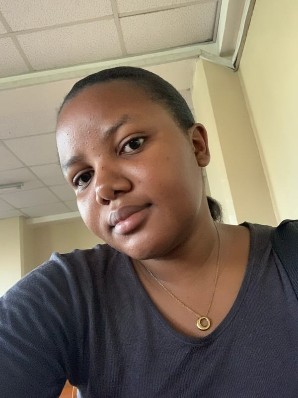 Person takes selfies and venue photos in Dar es-Salaam auditorium