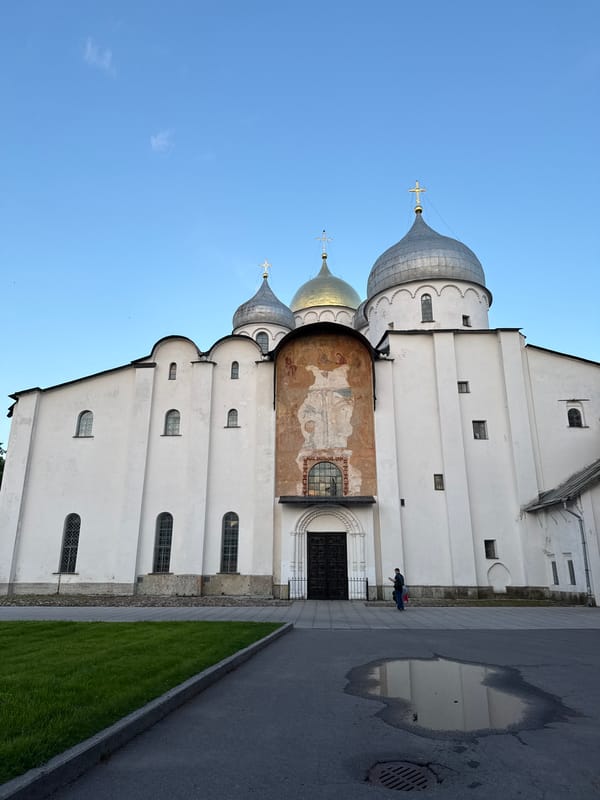 Evening visitors explore historic Veliky Novgorod kremlin landmarks