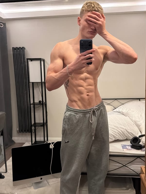 Man with smartphone observed in London bedroom setting