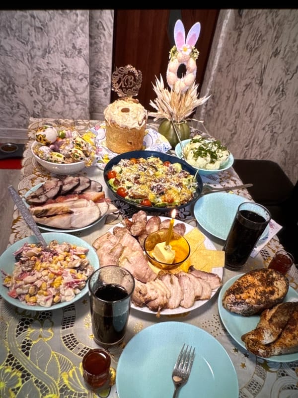 Food, flowers, and plush pigs in a Warsaw evening spread
