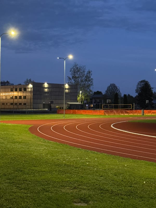 Evening view of illuminated running track in Carnikava, Latvia