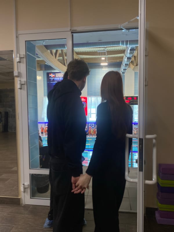 Man and woman observed in enclosed glass area