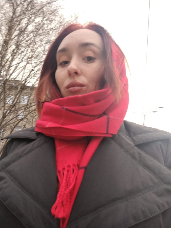 Woman in red plaid scarf observed in Izhevsk