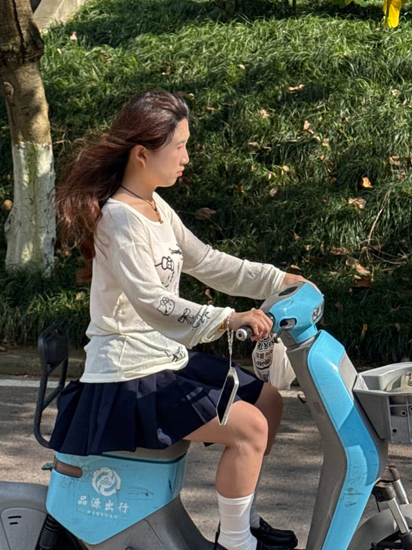 Morning foot traffic and scooters along Jiangjin paths