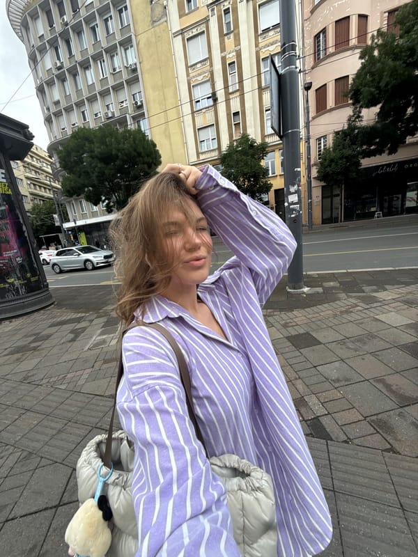 Woman takes selfie on Belgrade street Thursday morning