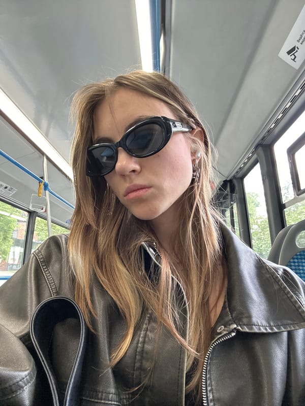Leather jacket and dark sunglasses on a Moscow bus