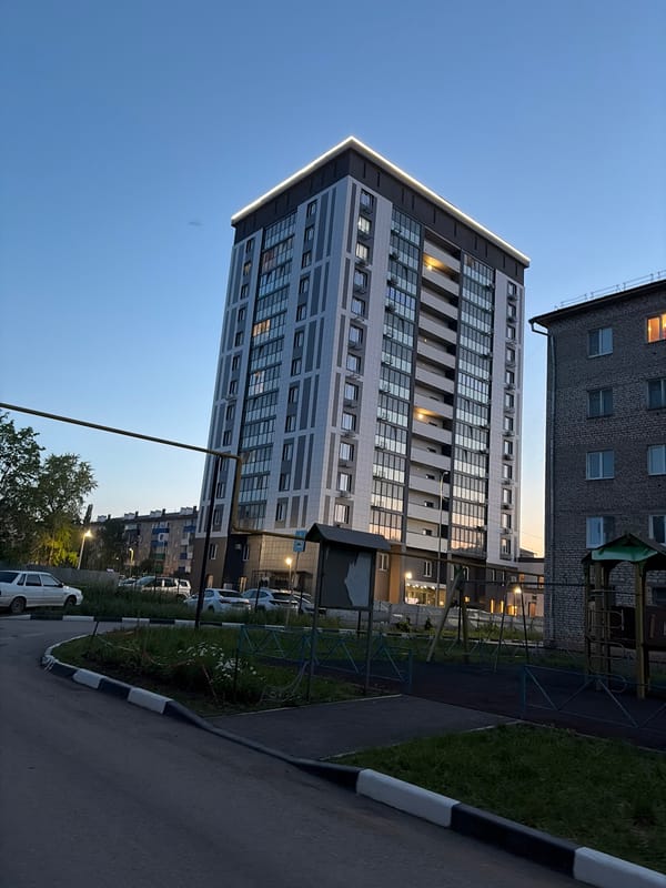 Dusk scenes of modern apartment buildings observed in Tujmazy