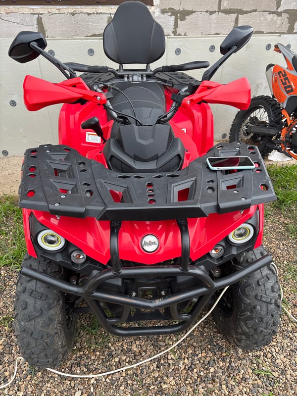 ATVs and a van parked up during a rural Russian road stop