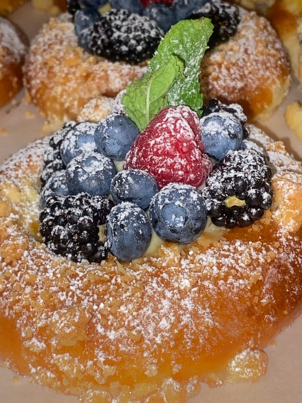 Warsaw café pastries and elaborate mythological murals, midday