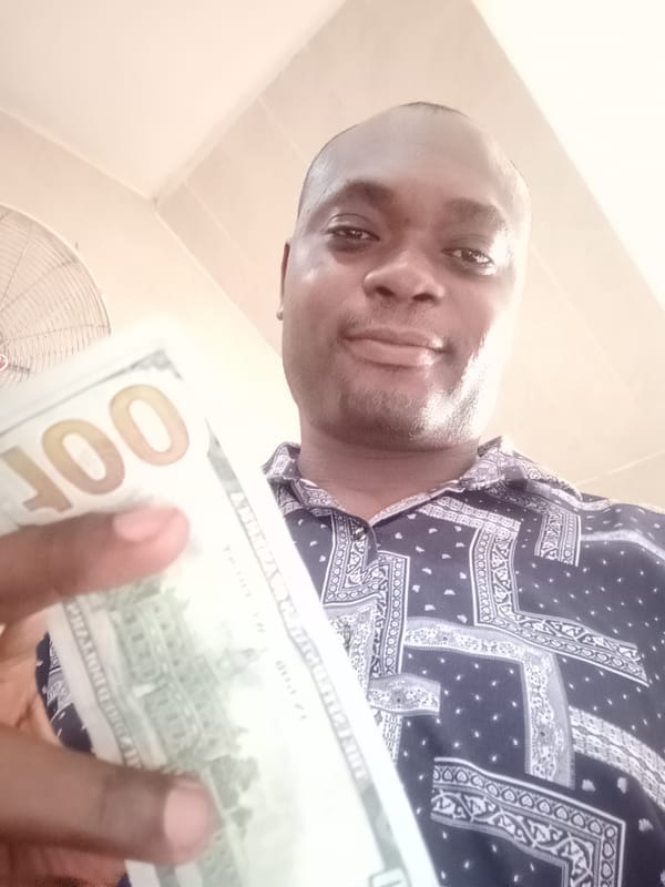 Man photographed multiple times in Gwarinpa home, dollar bill shown