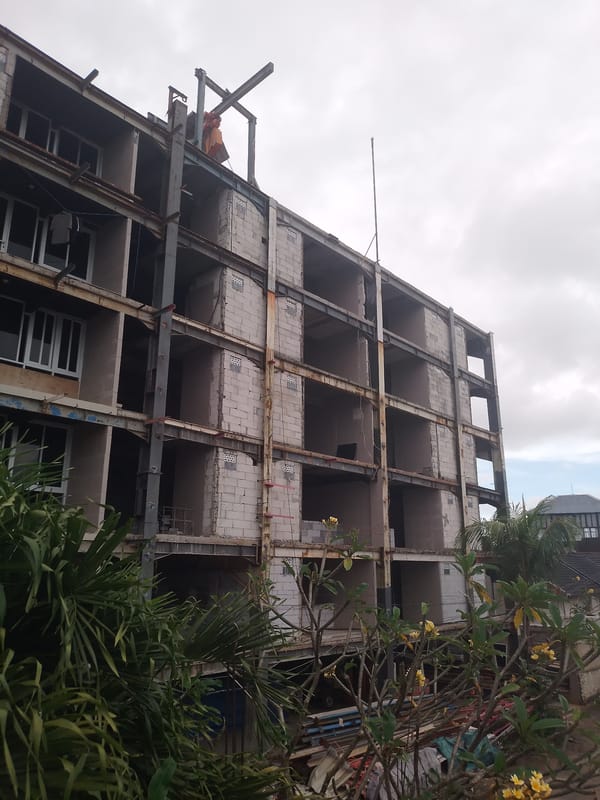 Building renovation and garden hose observed in Kuta Selatan