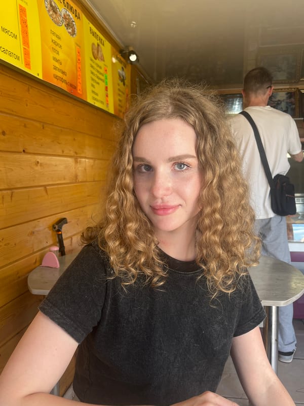 Woman takes selfie at table in Vasilyevo, Russia