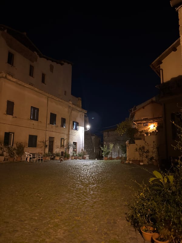 Evening life captured in historic Italian town square